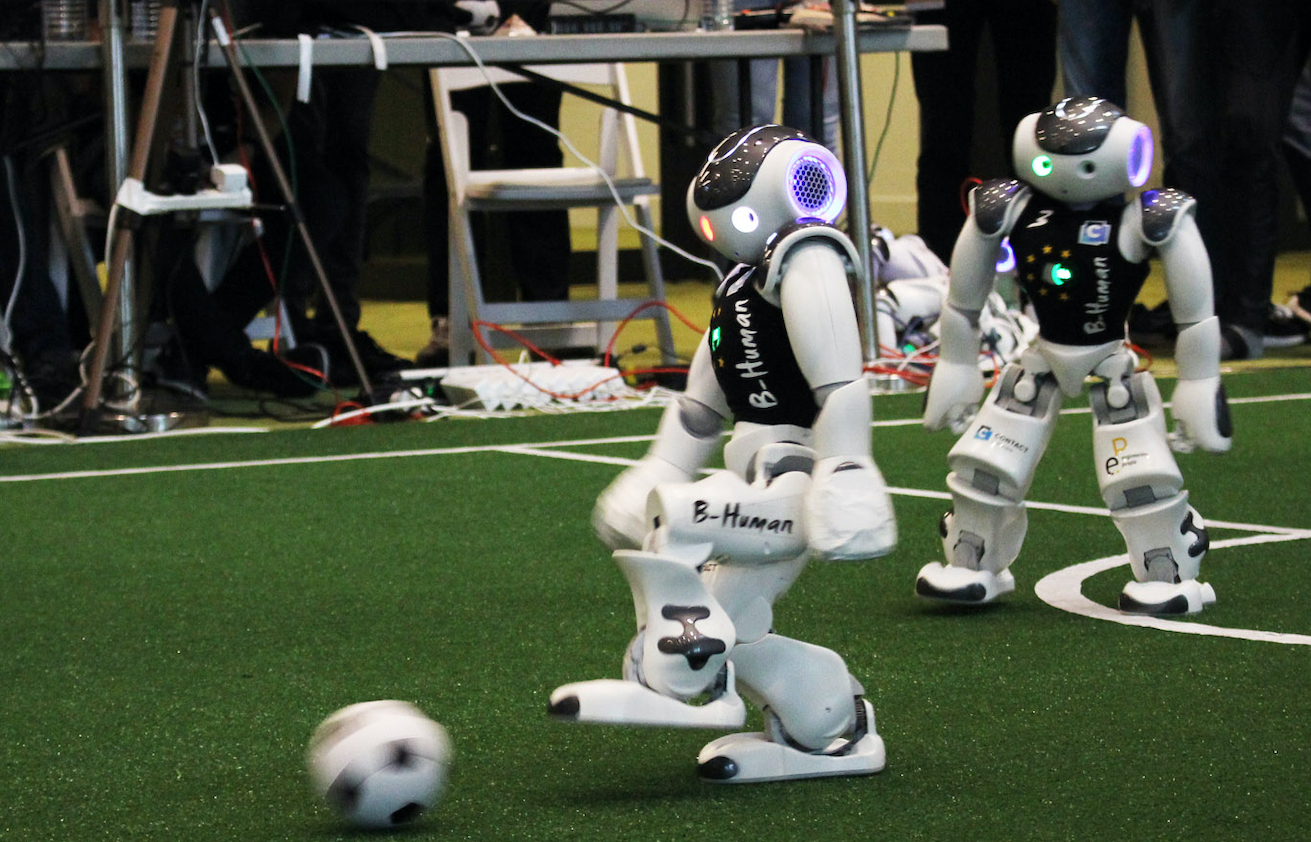 A B-Human robot carrying out a long forward kick